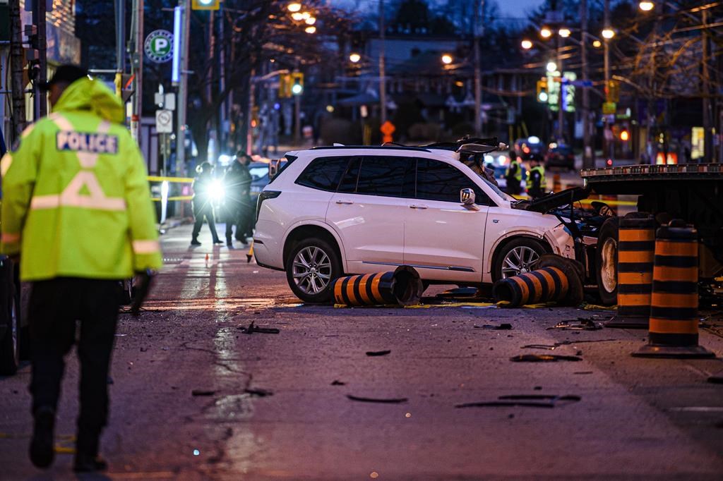 Three dead in crash involving car, pedestrians and flatbed trailer in Toronto