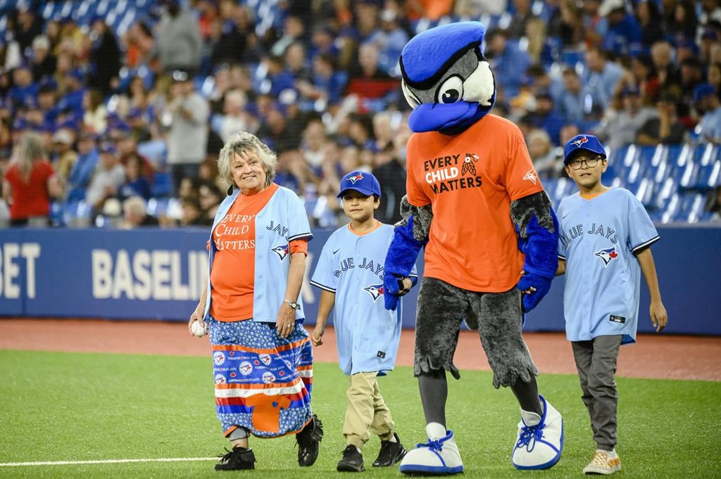 Residential school survivor throws first pitch at Jays game for Orange Shirt Day