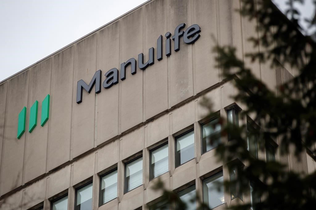 Manulife earning slip on market performance, hurricane costs