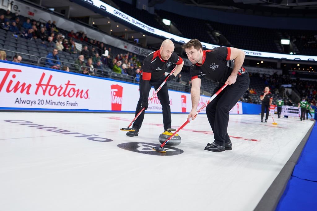 Playing with Hart: Lead Joe Hart and father Richard wearing Ontario colours at Brier