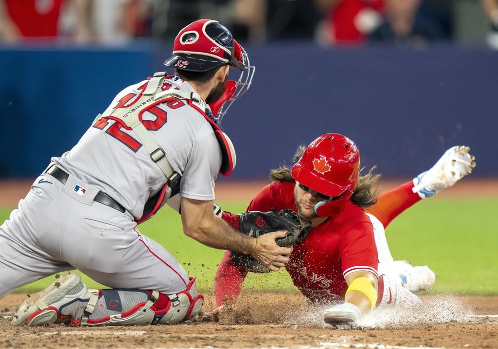 Close call at home has Boston Red Sox hold on to 7-6 win over Toronto Blue Jays