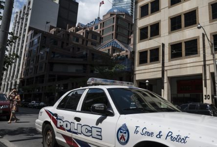 Officer first reported as ‘slashed,’ actually cut hand on glass door: Toronto police