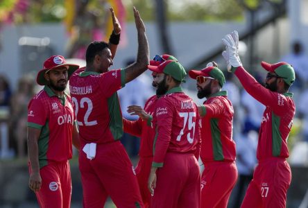 Oman holds on to edge Nepal with one ball to spare in cricket thriller